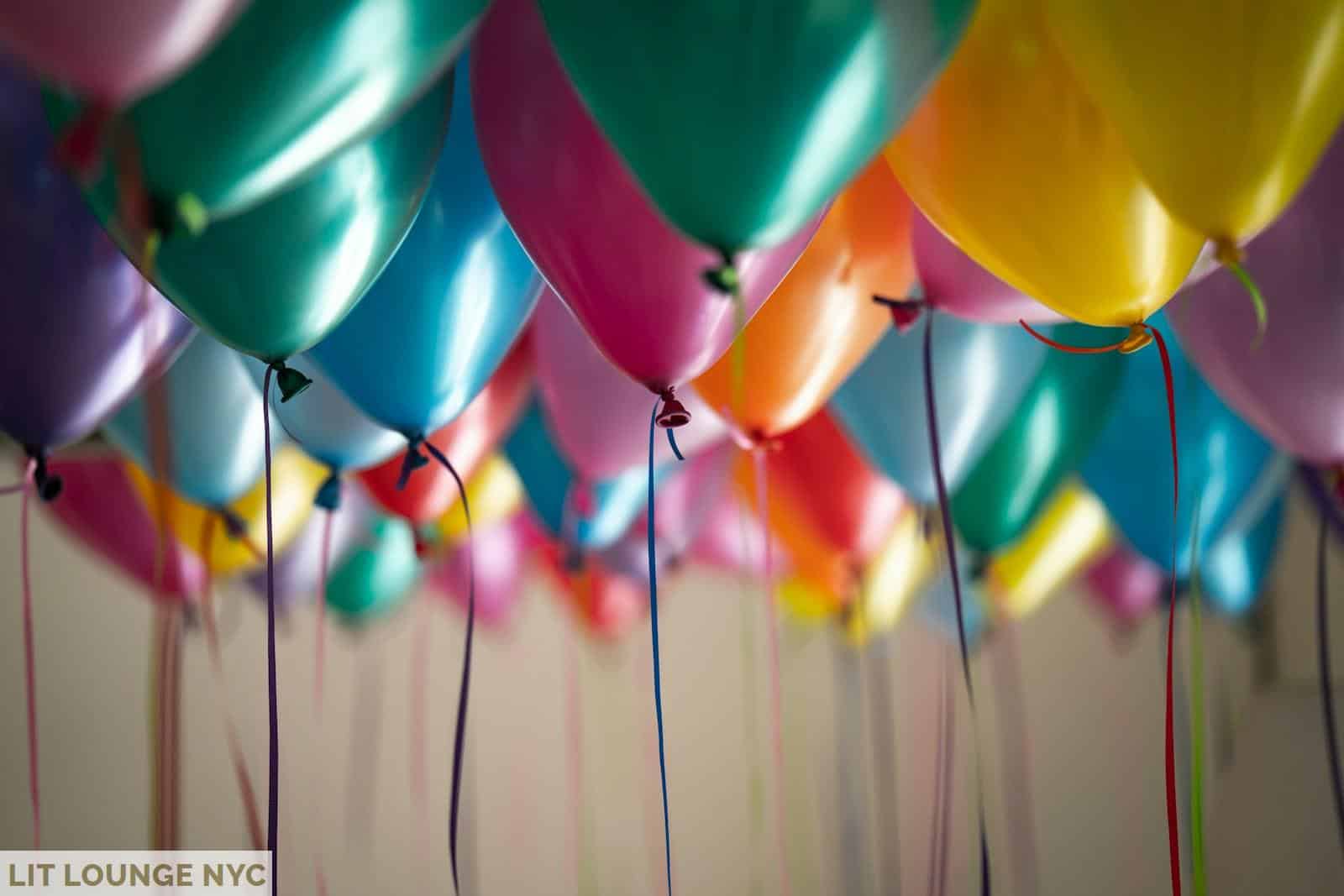 selective focus photography of assorted-color balloons